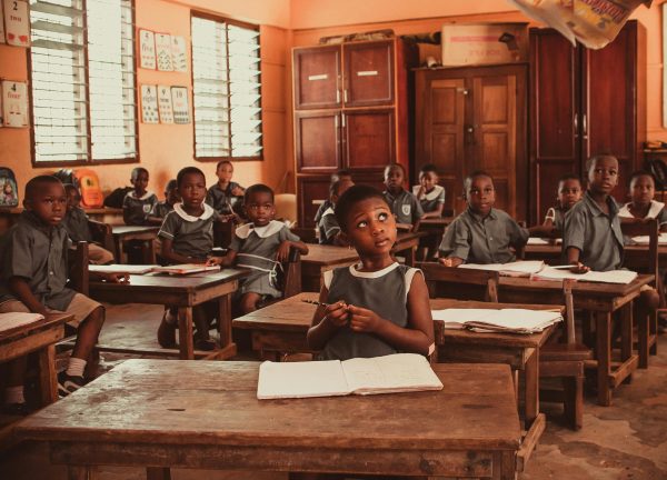 African children attentively participating in a classroom lesson, fostering education and learning.